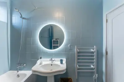 a blue bathroom with a sink and a mirror at Dream Views of Porto - Private Apt in Gaia by Lisbeyond in Vila Nova de Gaia