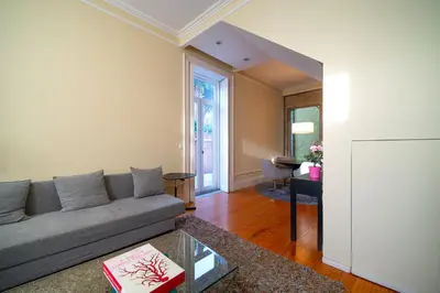 a living room with a couch and a table at Near Boavista - Free Parking in Porto