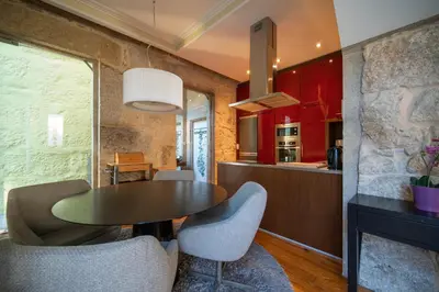 a kitchen and dining room with a table and chairs at Near Boavista - Free Parking in Porto