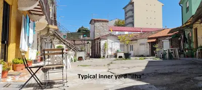 an empty alley in a city with a building at KirasHouse in Porto