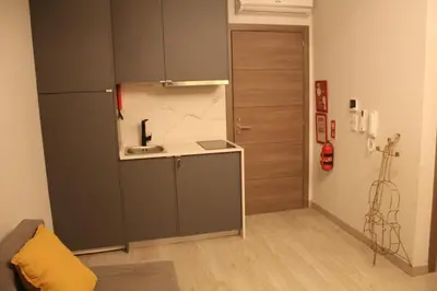 a small kitchen with a sink and a refrigerator at Apartment Art Jazz Music in Porto