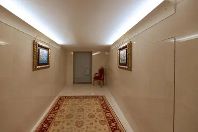 a hallway with a rug and two mirrors at FLH Porto Clérigos Luxury Apartments in Porto