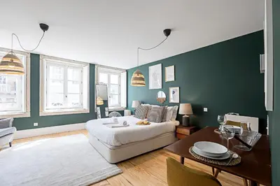 a living room with a bed and a table at Lóios 66 by LovelyStay in Porto