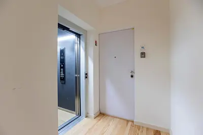 an empty room with a door and a window at 31 Janeiro 157 - Charming 1BR Flat w/ AC & Balcony by LovelyStay in Porto