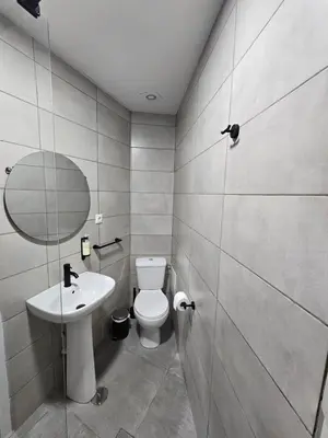 a bathroom with a toilet and a sink and a shower at Bonsai Apartment IIII in Porto