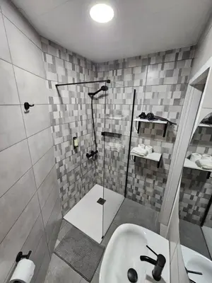 a bathroom with a shower and a sink at Bonsai Apartment IIII in Porto