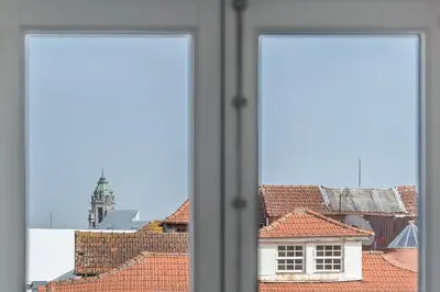 an open window with a view of roofs at GuestReady - The Other Side in Porto