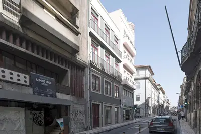 a street with buildings and a car parked on the street at Casinha da Formosa by Oporto Soul in Porto