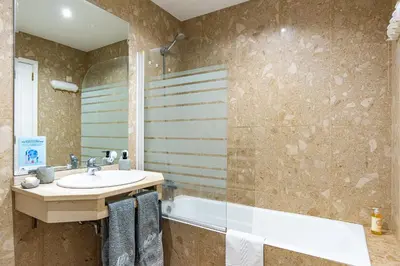a bathroom with a sink and a bath tub at River 9 and City View Porto Gaia by MP in Vila Nova de Gaia