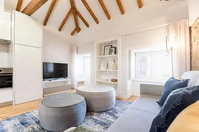 a living room with a couch and a table at Modern Cativo Apartment by LovelyStay in Porto