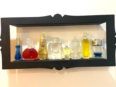 a shelf with different colored glass bottles on it at Cristelo 0 - near the river Porto in Porto