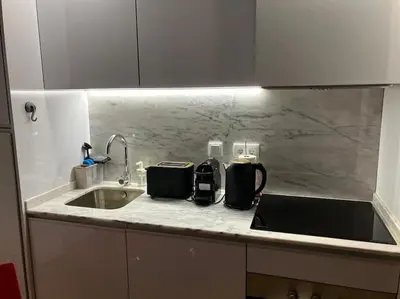 a kitchen counter with two toasters on a sink at Cristelo 0 - near the river Porto in Porto