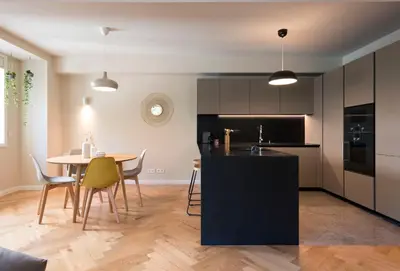 a kitchen and dining room with a table and chairs at Luxury City Center Emporium in Porto