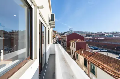 a balcony with a view of a city at Magnificent Sunny Flat - Douro River in Vila Nova de Gaia