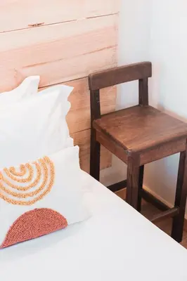 a bedroom with a chair and a bed at Campanha Apartment By Porto Stories in Porto