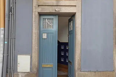 a blue door with a window in a building at FLH Porto Classic Apartment with Terrace & Parking in Porto
