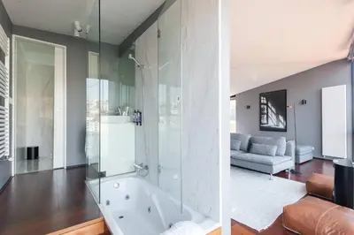 a bathroom with a tub and a living room at MY DOURO VIEW Stylish Gem River Front in Massarelos