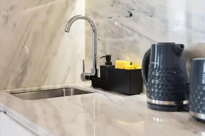 a kitchen counter with a sink and a mixer at GuestReady - Amazing Studio in the heart of Porto in Porto