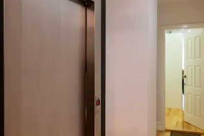 a door leading into a room with a hallway at A Window to Porto - Premium apartment by the River in Porto