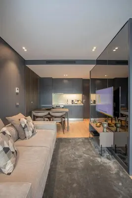 a living room with a couch and a flat screen tv at Liiiving in Porto - Dragão Pool View in Porto