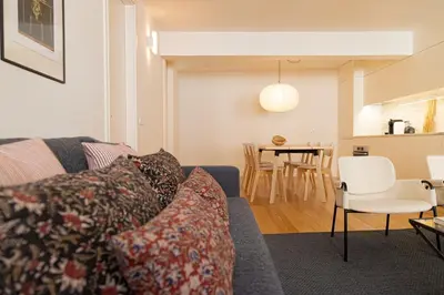a living room with a couch and a table at Taipas Townhouse 1865_Boutique Apart in Porto