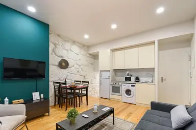a living room with a couch and a table at BmyGuest - Patio de Santa Catarina Apartment in Porto