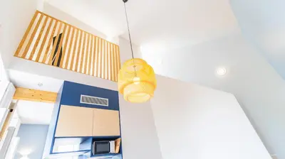 a wicker basket hanging from the ceiling of a room at Barros Lima 493 by LovelyStay in Porto