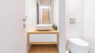a bathroom with a sink and a toilet at Barros Lima 493 by LovelyStay in Porto