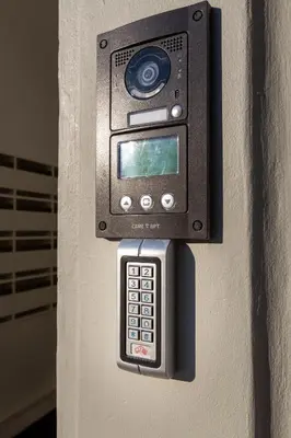 a cell phone is attached to a wall at Welcome Aliados a Noble apartment in City Heart in Porto
