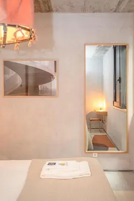 a bedroom with a mirror and a bed at Liiiving in Porto - Bolhão Trendy Apartments in Porto