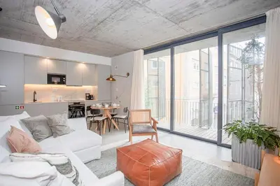 a living room with a white couch and a table at Liiiving in Porto - Bolhão Trendy Apartments in Porto