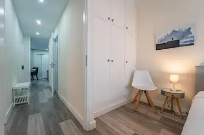 a living room with a couch and a television at Heart of Cedofeita in Porto