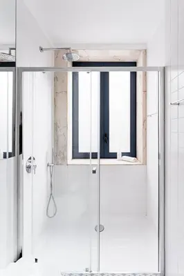 a shower with a glass door in a bathroom at HiddenGem - Cherry on Top in Porto