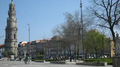 a city street with a clock tower and a building at Lapa City Flat Porto - by Guest SPA in Porto