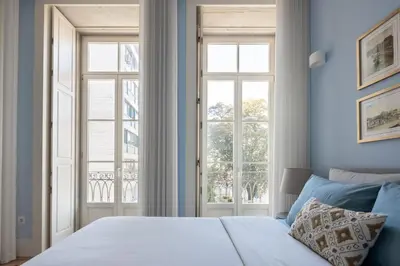 a bedroom with a bed and a window at CASA JOY Santa Catarina apartment in Porto