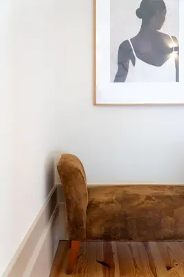 a brown couch in a room with a picture at Dom João Premium Apartment by DA'HOME in Porto