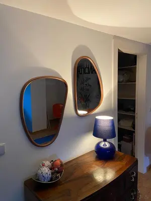 a table with a mirror and a lamp on it at Casa do Teatro in Porto