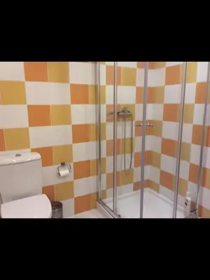 a bathroom with a shower and a toilet at Casa do Teatro in Porto