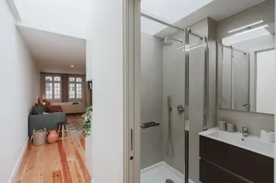 a bathroom with a shower and a sink at Casa Farrapos in Porto