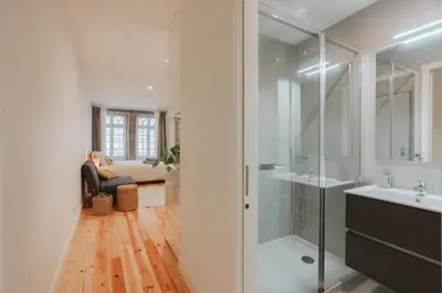 a bathroom with a shower and a sink at Casa Farrapos in Porto