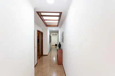 a hallway with white walls and a ceiling at Porto Residence Campanhã in Porto