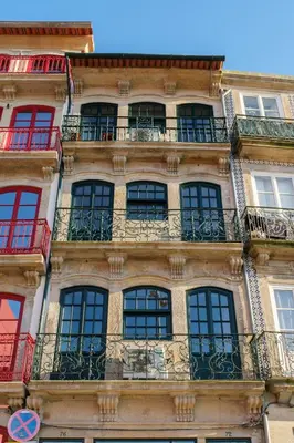 a tall building with windows and balconies at AgapeStay Porto in Porto