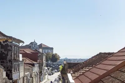 a view of a city street with buildings and cars at Cosy Flat Near Douro in Porto