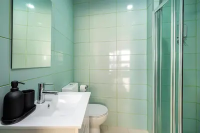 a bathroom with a sink and a toilet and a shower at WHome FT169 Top Location 2-Bed Perfect to explore Porto in Porto
