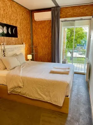a bedroom with a large bed and a window at LovePorto2 Balcony/Garden@Hist.C in Porto