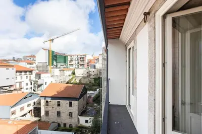 a balcony with a view of the city at São Bento Premium Loft - With Air Conditioning in Porto