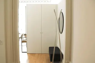 a room with a white cabinet and a mirror at Luxury Porto Unique in Porto