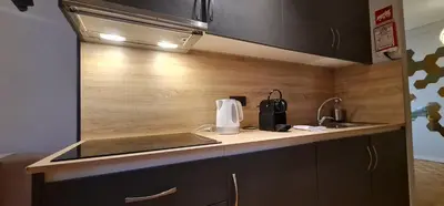 a kitchen with a sink and a counter top at Molecular Apartment in Porto
