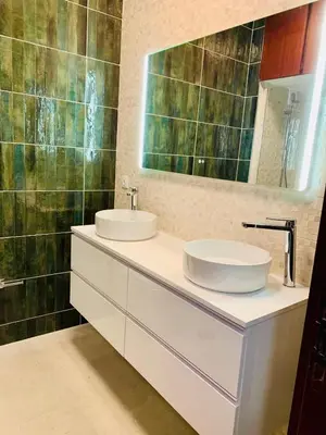 a bathroom with two sinks and a mirror at Bairro das arts in Porto