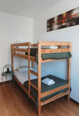 a couple of bunk beds in a room at Bairro das arts in Porto
